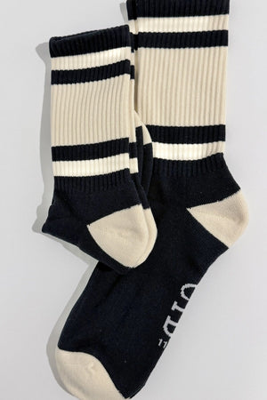 Cushioned Cotton Socks in Navy/Cream, pair laid flat with cream heels and the CIB logo on the sole